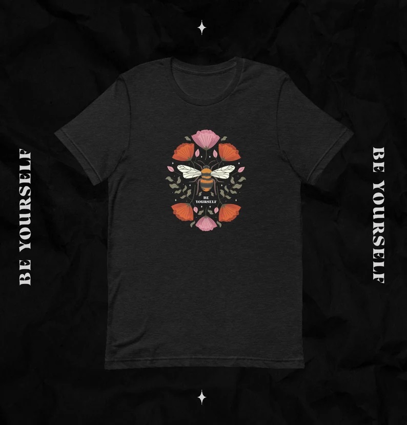 T-shirt mockup features the BE YOURSELF design from Forensics and Flowers
